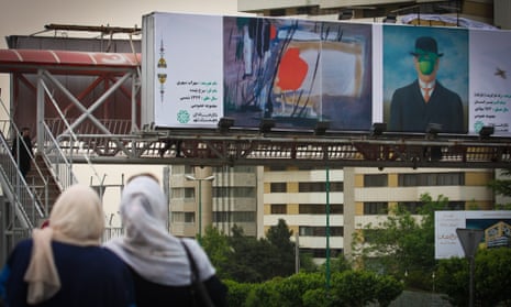 A Tehran street billboard shows The Son of Man next to a painting by Sohrab Sepehri