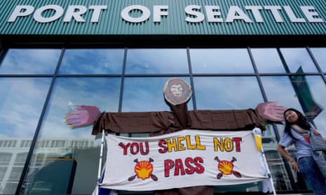 Activists rally outside the Port of Seattle offices during a "Seattle Draws The Line" rally to take a stand against dirty fossil fuel projects such as Shell's plan to stage their Arctic drilling fleet at the port.