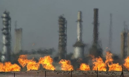 Fires flare off the gas from crude oil at Iraq's oldest oil processing plant in the town of Baba Gurgur.