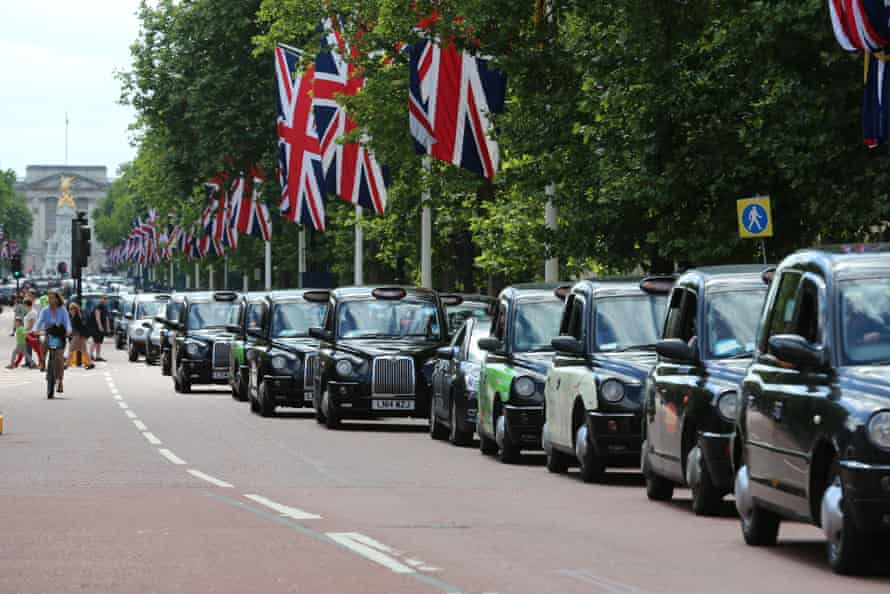 Black cab and licensed taxi drivers protest against Uber on The Mall, London.