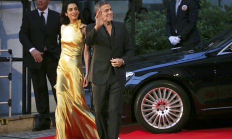 U.S. actor George Clooney and his wife, Amal, arrive for the Japan premiere of Disney's latest film Tomorrowland in Tokyo last week.