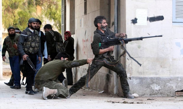 A Free Syrian Army fighter fires his weapon during clashes in Aleppo. The Old Bailey was told by the crown that there was no longer a reasonable prospect of a prosecution.