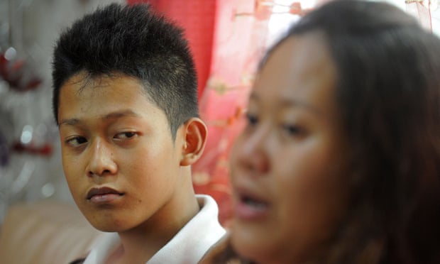 Reynaldo Nilo, 17, looking on with his sister Sarah Joy Nilo at a relative's home in Manila.