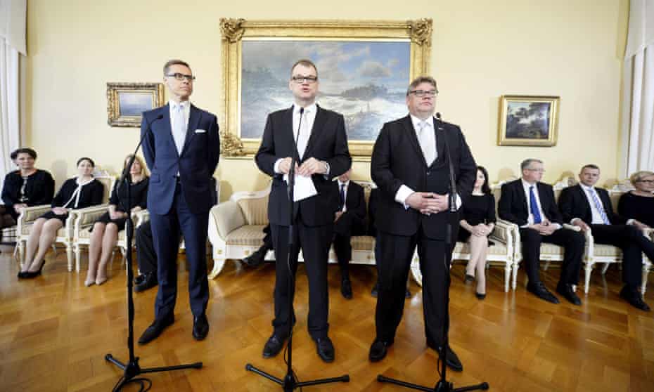 Centre, new Finnish Prime Minister Juha Sipila, with governmental coalition partners – foreign minister Timo Soini (right), chairman of Finns party, and finance minister Alexander Stubb (left), chairman of the National Coalition party.