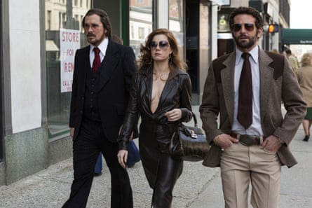 Christian Bale, Amy Adams and Bradley Cooper in American Hustle.