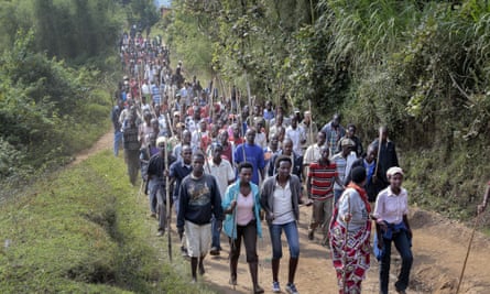 Demonstrators opposed to a third term for President Nkurunziza march before army soldiers shot in the air to disperse the protest, in the rural area of Mugongomanga, east of the capital Bujumbura, in Burundi on Wednesday.