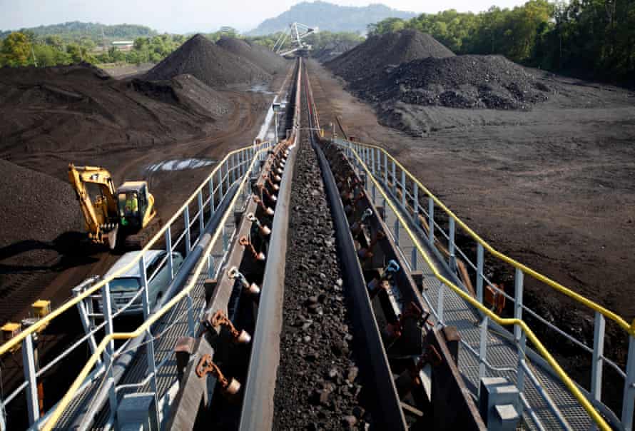 Coal is moved on a conveyor belt at the PT Bukit Asam open pit coal mine in Tanjung Enim, South Sumatera province, Indonesia
