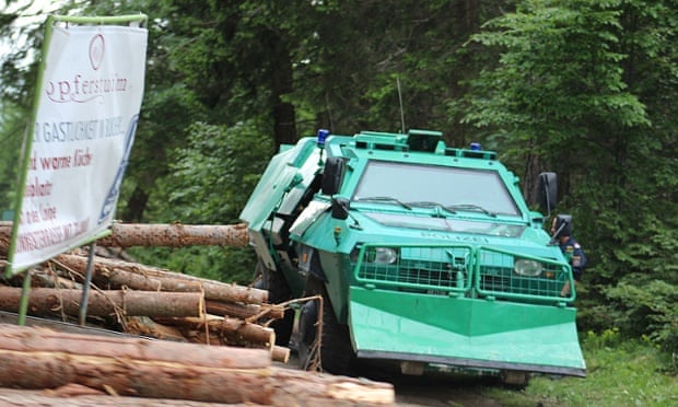An armoured personnel carrier sits in the woods during the Bilderberg conference.