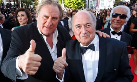 Gerard Depardieu, Sepp Blatter and two photobombers on the red carpet for United Passions at Cannes last year.