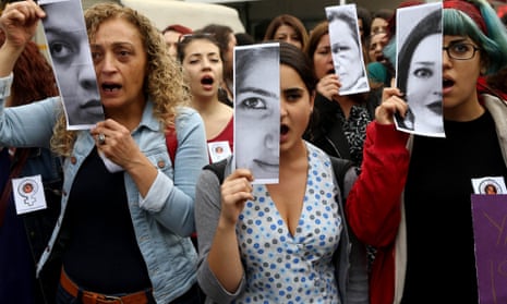 Turkish women at a demonstration in Ankara display photographs of Özgecan Aslan, a student who was killed while resisting an attempted rape.