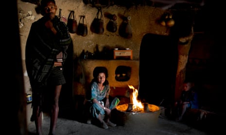 Tensae Belachew, with her husband, left, and her young son, right, in their home in the village of Addis Ge, near Fiche, Ethiopia. Tensae was 13 when she got married.