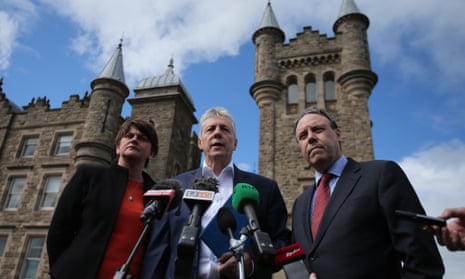 The DUP’s Arlene Foster, leader Peter Robinson and Nigel Dodds, in front of Stormont during talks earlier this month on how to save the deal to agree welfare cuts in return for a Treasury loan.