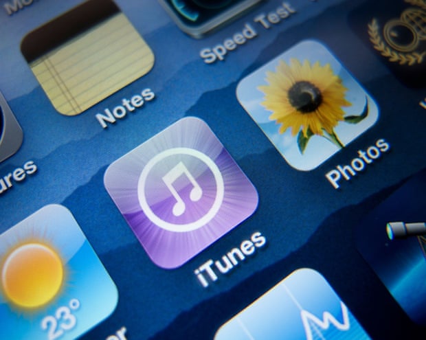 Close-up of screen of iPhone 4G smartphone showing iTunes music app.