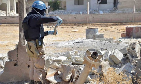A UN weapons inspector appears to collect samples in Syria, 2013.