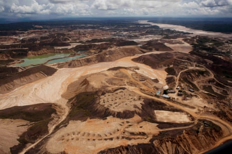 An aerial photo shows the scope of illegal mining in Huepetuhe district  in Peru's Madre de Dios region in Peru, Monday, April 28, 2014. The mining uses tons of mercury and has ravaged forests and poisoned rivers. Authorities began enforcing a ban on illegal mining in the Huepetuhe district. They had given the state s illegal miners until April 19 to get legal or halt operations.