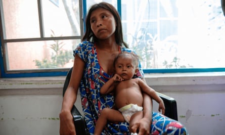 Paola Uriana, 17, sits with her daughter Sara Sofía Uriana, 7 months, in the Center for Nutritional Recuperation.