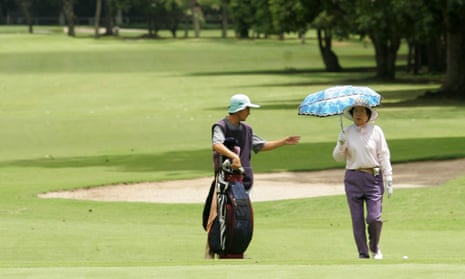 A golfer on the course of the Caracas Country Club.