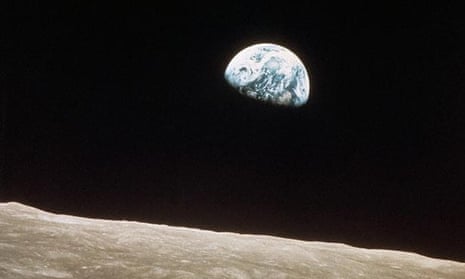 This view of the rising earth greeted the Apollo 8 astronauts as they came from behind the moon after the lunar orbit insertion burn.