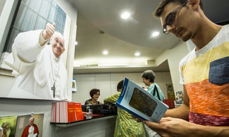 People buy copies of Pope Francis's encyclical letter Laudato Si'