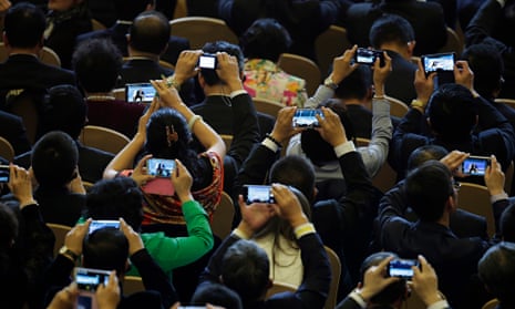 Delegates use their smartphones
