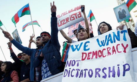 People attend an opposition rally in Baku