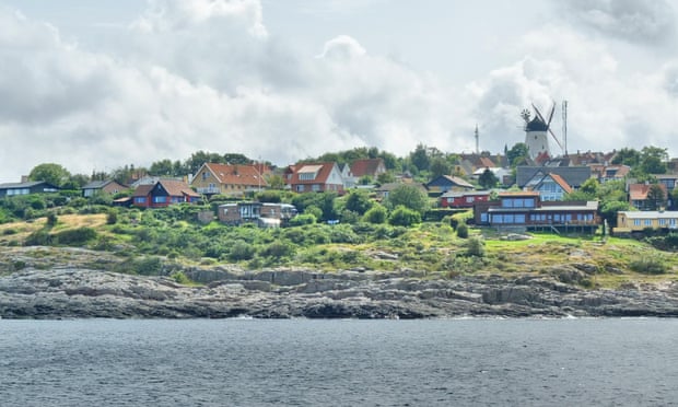 E5XG3W Denmark, Bornholm Island Pictures taken between 1st and 5th August 2014.  Pictured: General view of the Gudhjem citybornholmdenmarkislandviewErtholmeBornholmzelandiazelandwidokturpodnexogudhjemsvanekewybrzezecoastgeneralwievharborportstreetsdaylifedenmarkdanishflagflagdenmarkflagdunskaflaga