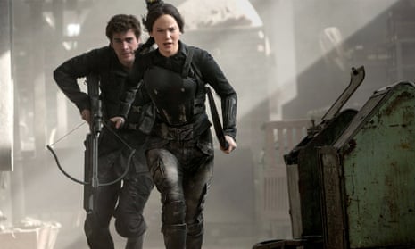 Jennifer Lawrence and Liam Hemsworth as Katniss and Gale.