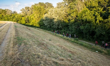 Syrian migrants make their way through the woods outside of Kanjiza, Serbia.