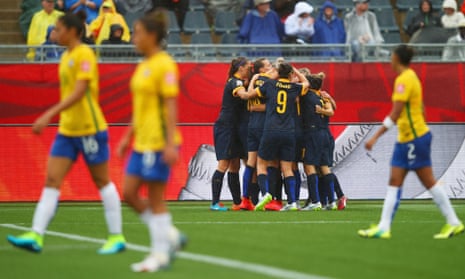 Brazil players look dejected as Kyah Simon of Australia celebrates with team mates as she scores their first goal.