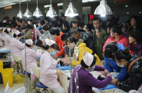 Children receive intravenous transfusion at Xi'an Children's Hospital on December 24, 2013 in Xi an, China. Heavy smog covered many parts of China on Christmas Eve, worsening air pollution.