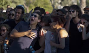 photo, friends of Staff Sgt. Matan Gotlib, a Maglan elite unit soldier, mourn during his funeral in the military cemetery in Rishon Letzion, central Israel.
