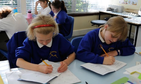 Primary school children writing