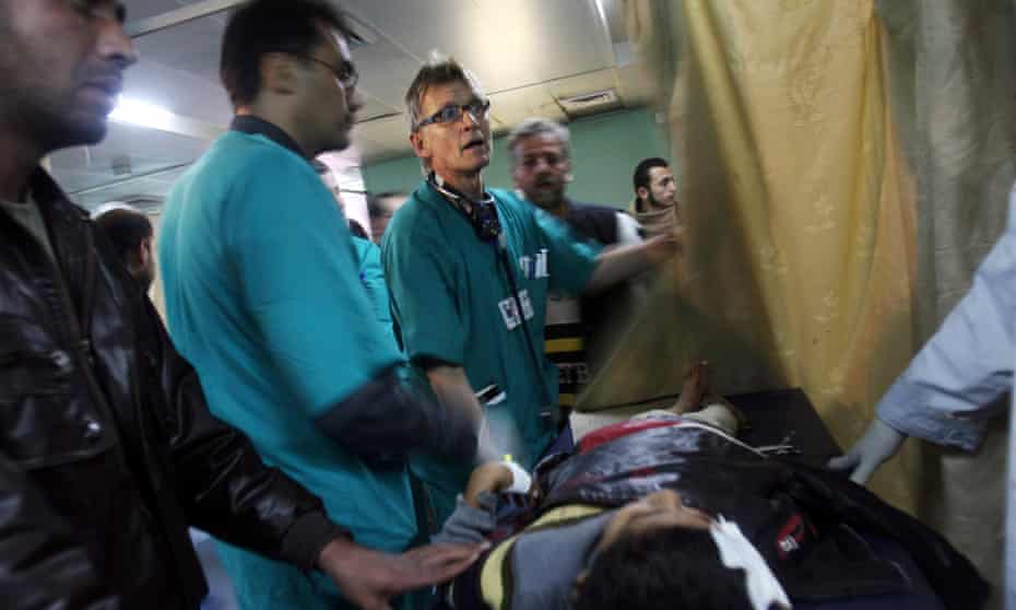 Dr Mads Gilbert treats a patient at Shifa hospital in Gaza