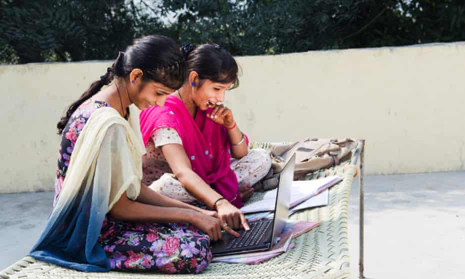 Indian rural student with laptop at home