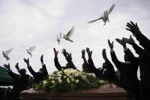 Pallbearers release doves over the casket holding Ethel Lance, a victim of the Emanuel AME Church shooting, during her burial in Charleston, South Carolina.