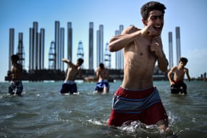 Teenagers from a boxing school take part in a training session in the Caspian Sea