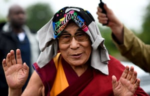 The Dalai Lama greets wellwishers before addressing a crowd gathered at the Stone Circles during Glastonbury