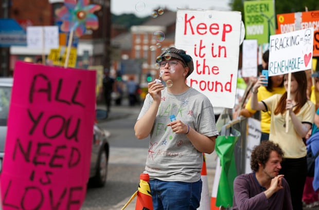 An anti-fracking protester blows bubbles during a demonstration outside County Hall in Preston, Britain June 24, 2015. Lancashire County Council is debating an application by shale gas firm Cuadrilla Resources to frack on the Fylde coast, local media reported.