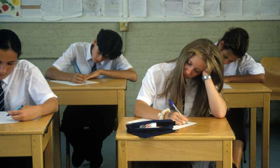 Schools pupils taking exams.