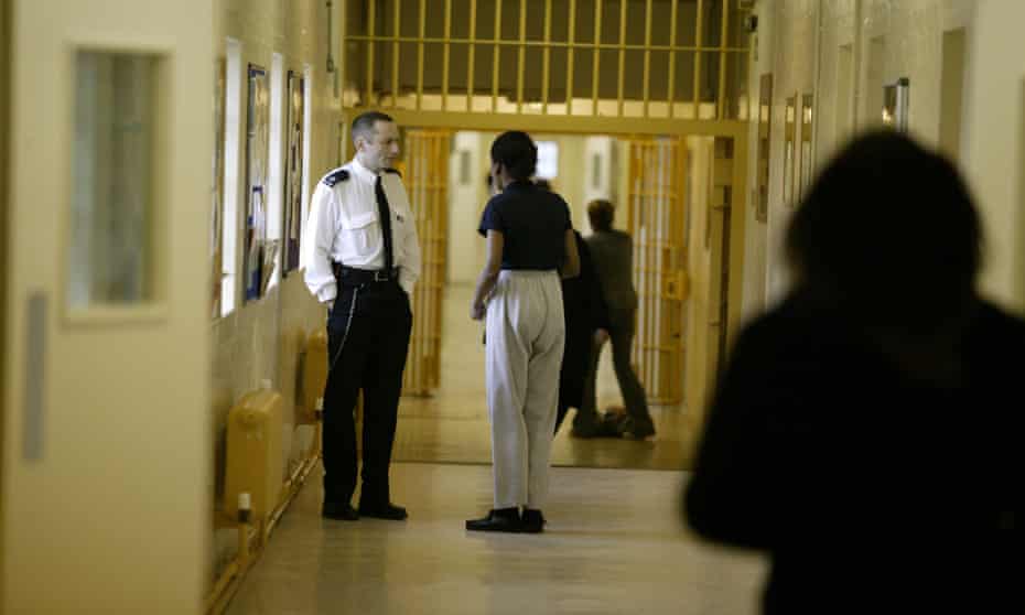 A warden talks to a prisoner at Brockhill women’s prison in Redditch, Worcestershire. Prison governors now have a duty to prevent extremist radicalisation occurring.