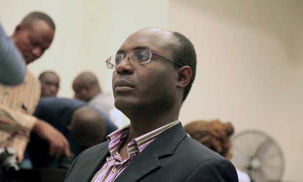 Journalist Rafael Marques de Morais sits in court in Luanda where he was given a six-month suspended sentence after being convicted of slander.
