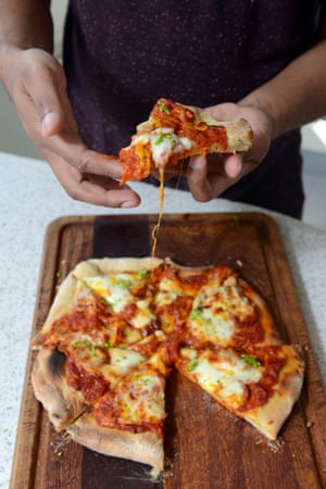 Pizza cooked in a pizza oven.