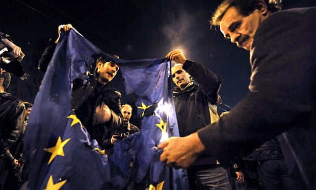 Greek protesters burn an EU flag