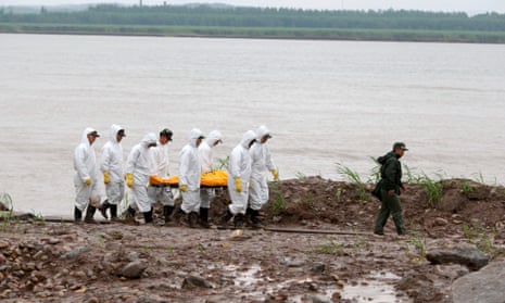 Rescuers carry the body of a victim recovered from the capsized cruise ship Eastern Star on the bank of the Yangtze river in Jianli county, China.