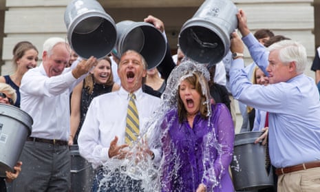 Staffers douse Tennessee Governor Bill Haslam and his wife, Crissy, with cold water. 