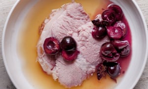 Nigel Slater's gammon with apple juice and pickled cherries recipe on a round plate
