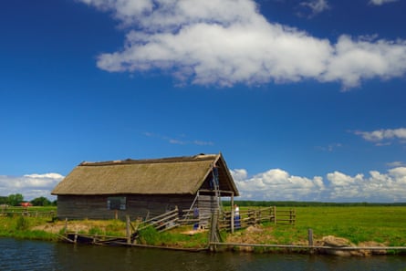 People working on a reed roofon the island Wydrza K  pa. Wydrza K  pa is an island in the back delta of the river Swine in Poland.The island is situated south of the village Przyt  r, in between the river arms G  sia and Kacza.