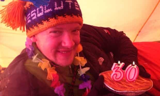 Philip, with a cake and candles in the tent, celebrates his 30th birthday.