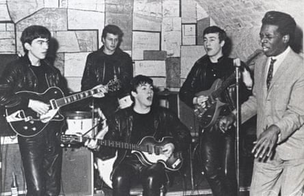 The Beatles performing at the Cavern Club in Liverpool, c.1962: George Harrson, left, has the Gretsch guitar he bought from Bill's friend.