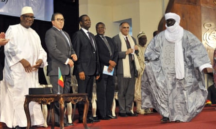Mahamadou Djery Maiga (R), the vice-president and spokesman of the Transitional Council of the State of Azawad walks towards Mali's President Ibrahim Boubacar Keita (L), following the signing of the ammended version of the Algerian Accord on June 20, 2015 in Bamako. Mali's Tuareg-led rebel alliance signed the landmark deal to end years of unrest in a nation riven by ethnic divisions and in the grip of a jihadist insurgency.